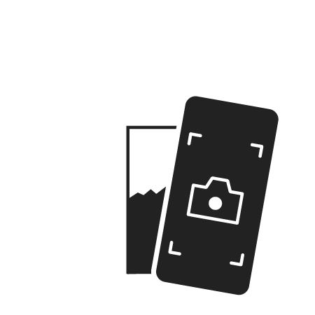 Screenshot of "How to" video. A hand holding a phone in camera mode scanning a QR code